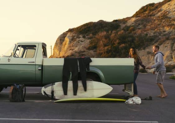 surfing couple with pickup truck at newport beach 2023 11 27 05 27 54 utc