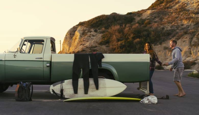 surfing couple with pickup truck at newport beach 2023 11 27 05 27 54 utc